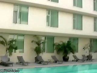 amazing t-girl poses in bikini poolside and strips in shower