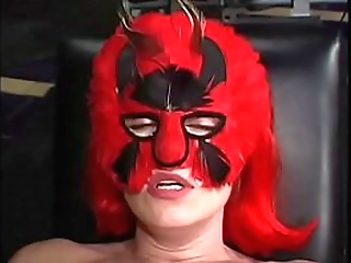 red haired masked woman dominates sexy shemale