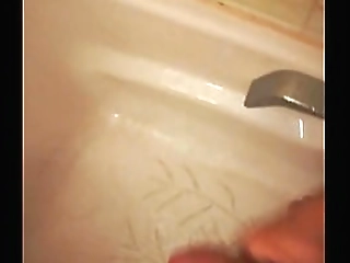hot shemale, getting soaked in golden nectar, pissing with an amazing force!